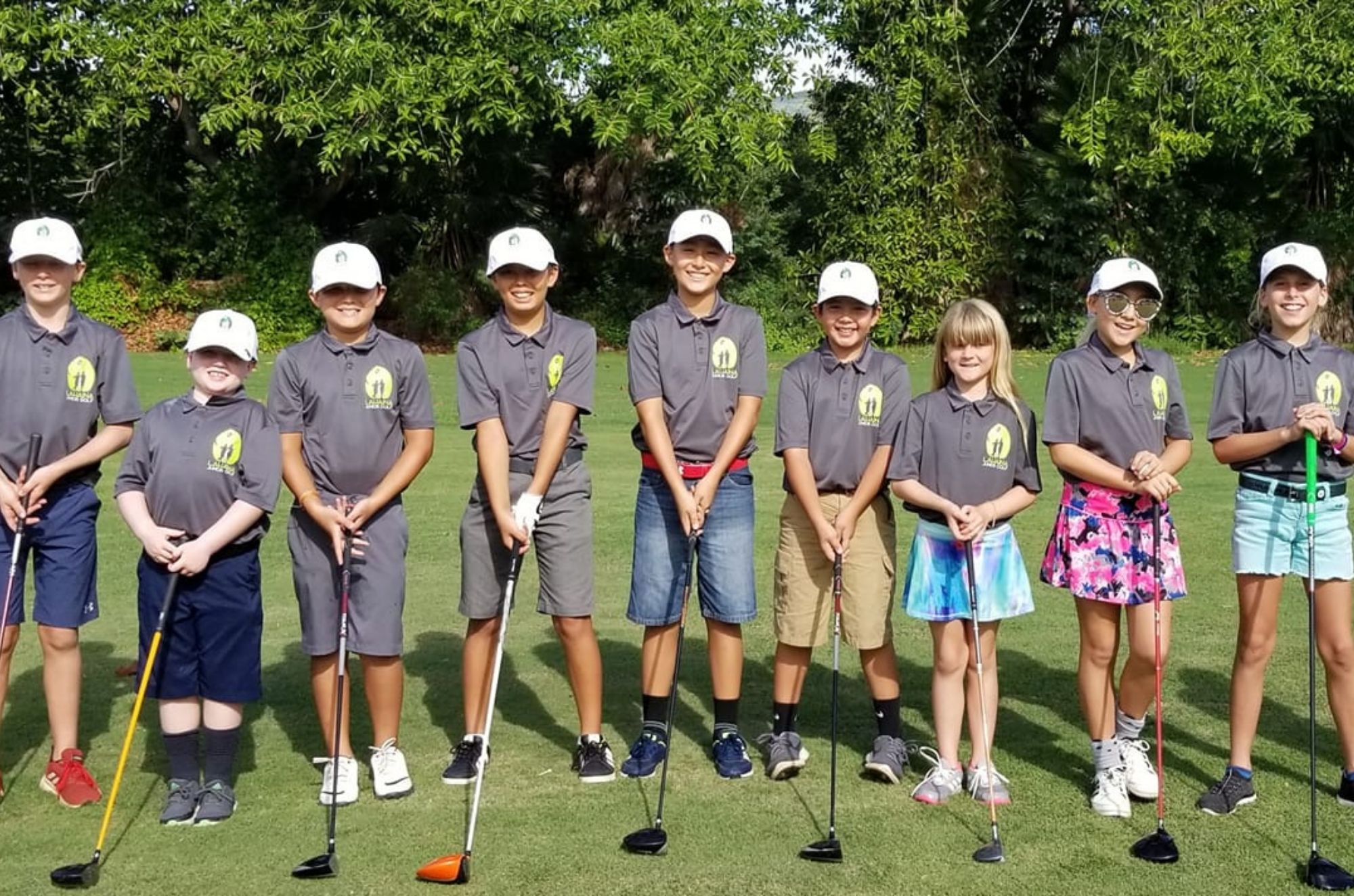 line up of student golfers with clubs